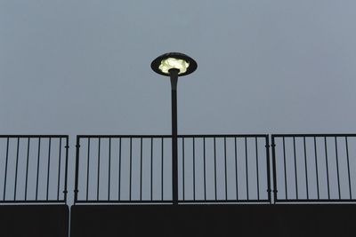 Low angle view of street light against sky