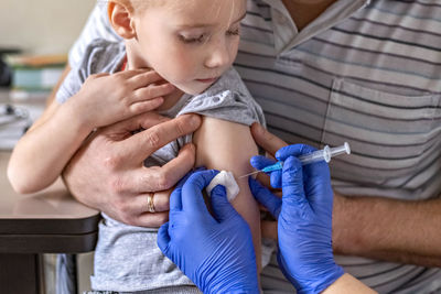 A little girl in the doctor's office. the concept of vaccination, prevention against covid-19