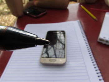 High angle view of mobile phone on table