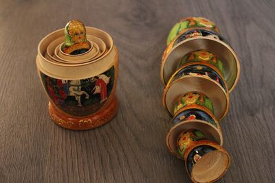 High angle view of multi colored russian nesting dolls on table