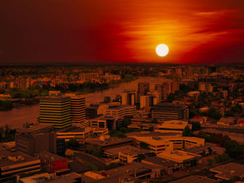 High angle view of buildings against sky during sunset