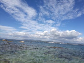 Scenic view of sea against blue sky