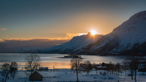 Scenic view of lake against sky during sunset