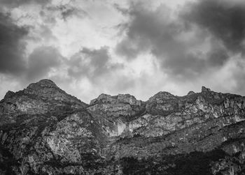 Low angle view of rock formations against sky