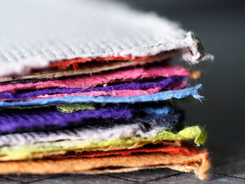 Stack of colorful textiles on table