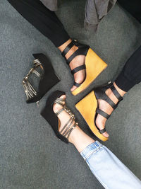 Low section of woman wearing high heels