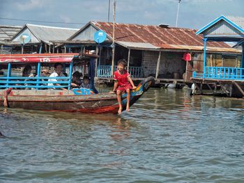 Man sailing on boat in water