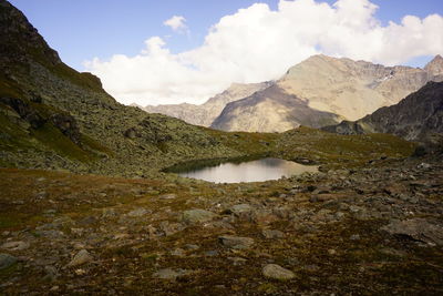 Scenic view of lake and mountains against sky