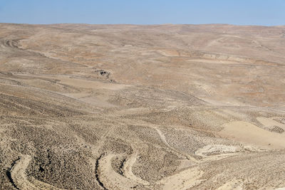 Scenic view of desert against clear sky