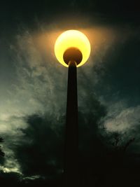 Low angle view of silhouette sun against sky during sunset