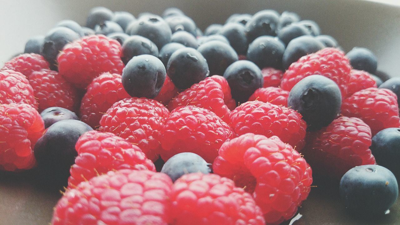 fruit, food and drink, red, indoors, food, berry fruit, raspberry, freshness, strawberry, close-up, blueberry, berry, still life, high angle view, sweet food, healthy eating, black color, no people, blackberry - fruit, large group of objects