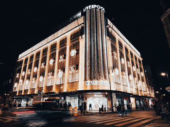 Illuminated buildings in city at night