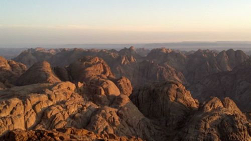 Scenic view of mountains against sky during sunset