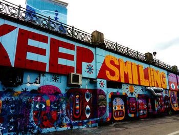Graffiti on wall against sky