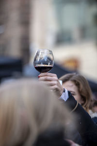 Midsection of woman holding drink