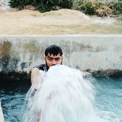 Portrait of man in pond