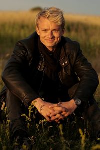 Portrait of woman standing on field