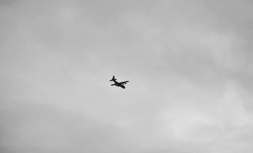 Low angle view of airplane flying in sky