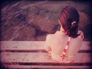 Full length of woman standing by railing