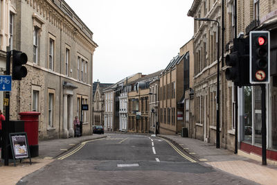 Street in city against clear sky