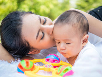 Portrait of mother and daughter outdoors