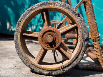 Close-up of rusty wheel on street