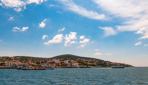 Scenic view of sea and buildings against sky