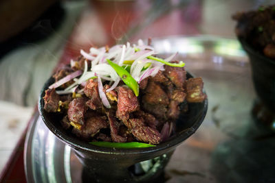 Close-up of meat in bowl on table