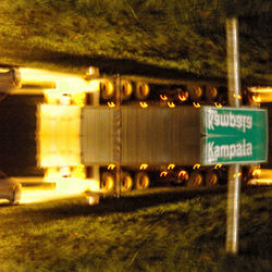 Illuminated text on field at night