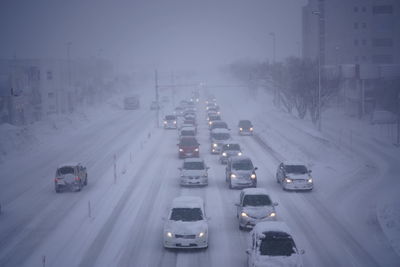 High angle view of vehicles on road in winter