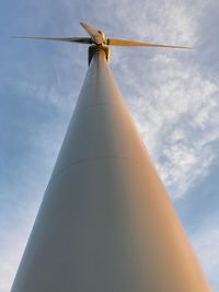 Low angle view of windmill against sky
