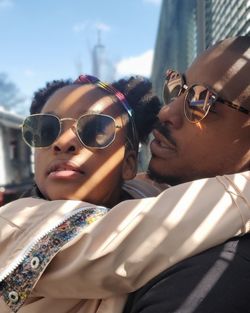 Portrait of young man wearing sunglasses against sky