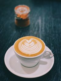 Close-up of cappuccino on table