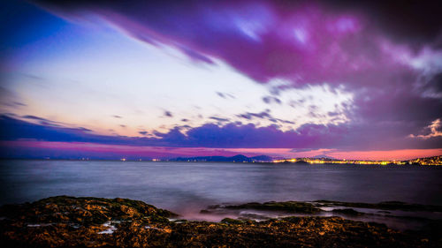 Scenic view of sea against dramatic sky