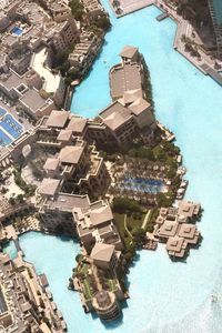 High angle view of swimming pool amidst buildings in city