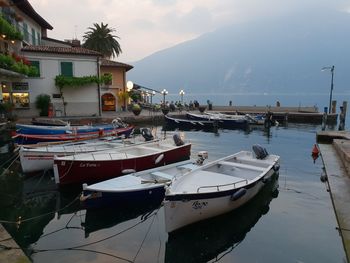 Boats moored in sea against sky