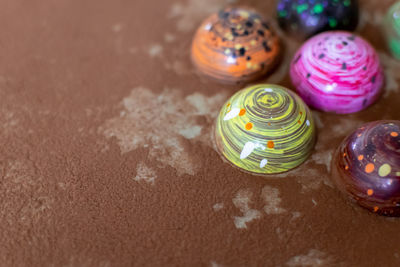 High angle view of multi colored candies on table