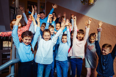 Group of people standing against the wall