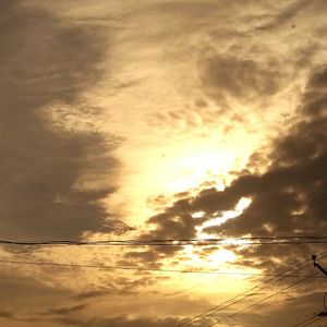 Low angle view of cloudy sky at sunset