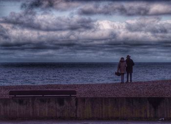 Scenic view of sea against cloudy sky