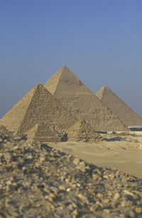 Scenic view of desert against clear blue sky