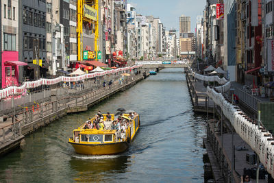 High angle view of river amidst buildings in city