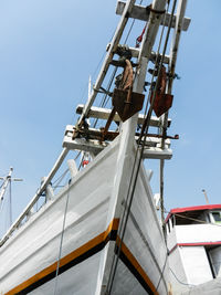 Low angle view of sailboat against clear sky