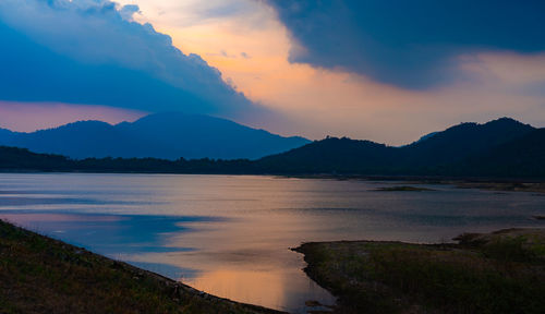 Scenic view of lake against sky during sunset