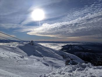 Scenic view of snow covered mountain against sky