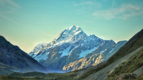 Scenic view of snowcapped mountains against sky