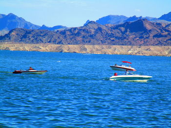 Boat in lake against sky