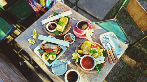 Multi colored objects on wooden table