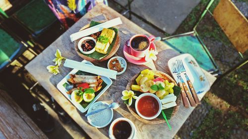 High angle view of food served on table in yard