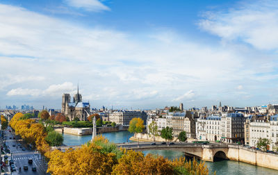 Bridge over river with buildings in background